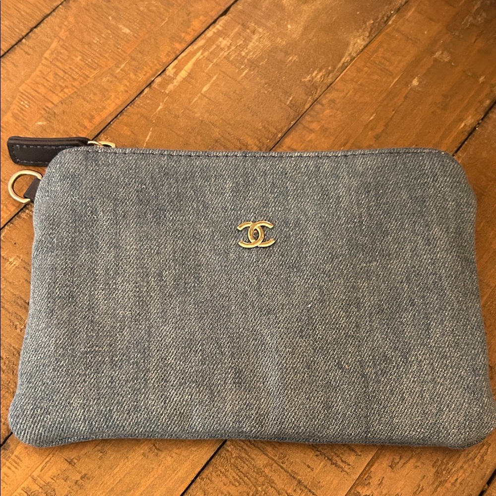 CHANEL Blue Denim Pouch with Gold Emblem